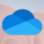 A modern minimalist home office featuring a sleek, thin laptop with an integrated AI processor logo on the palm rest.