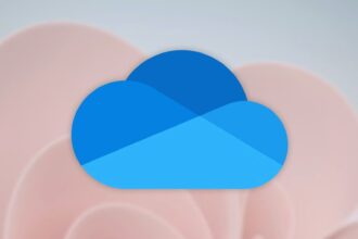 A modern minimalist home office featuring a sleek, thin laptop with an integrated AI processor logo on the palm rest.