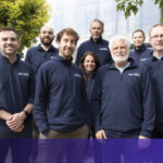 Biotech researchers in a Dublin laboratory developing advanced RNA delivery systems to penetrate the blood-brain barrier for neurodegenerative treatment