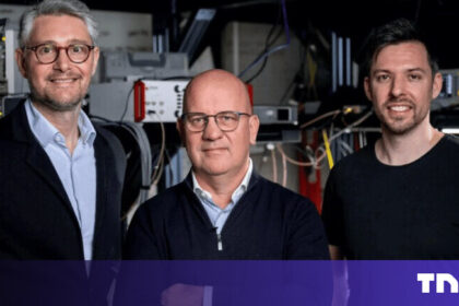 Researchers in a sterile Paris laboratory working on a complex dilution refrigerator for quantum hardware development funded by Quantonation Ventures