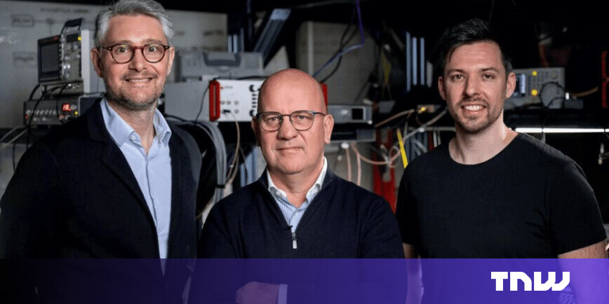 Researchers in a sterile Paris laboratory working on a complex dilution refrigerator for quantum hardware development funded by Quantonation Ventures