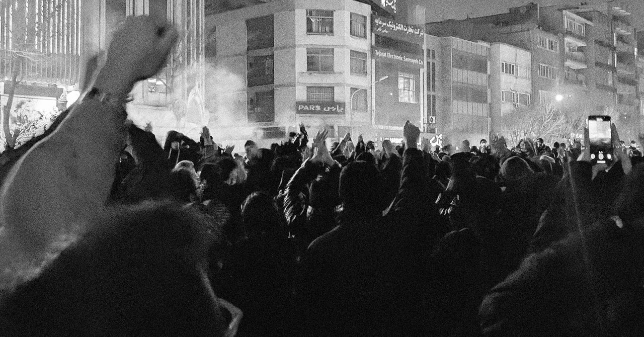 Digital map of Iran fading into darkness with connection cables severed