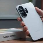 Close-up of a modern Samsung smartphone display showing the Google Play Console interface with technical device specifications.