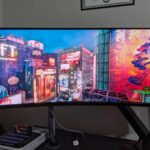 A minimalist smartphone home screen in 2026 showing a single glowing AI interface replacing rows of traditional colorful application icons.