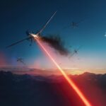 An advanced AeroVironment LOCUST laser weapon system mounted on a tactical vehicle during a drone defense exercise in the Texas desert.