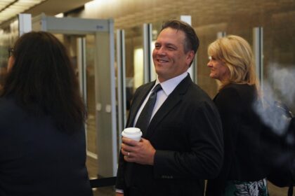 Phil Spencer and Asha Sharma standing together at a Microsoft corporate event, symbolizing the leadership transition in the gaming division.