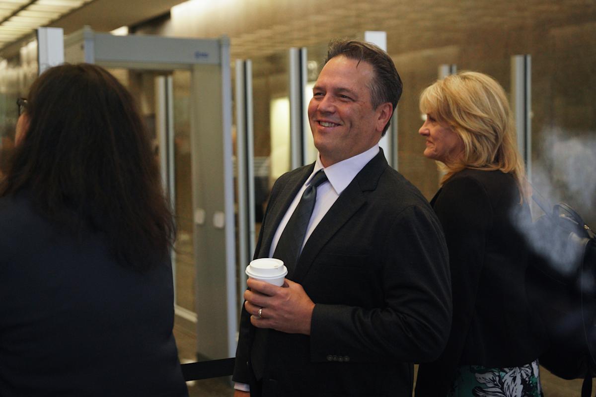 Phil Spencer and Asha Sharma standing together at a Microsoft corporate event, symbolizing the leadership transition in the gaming division.