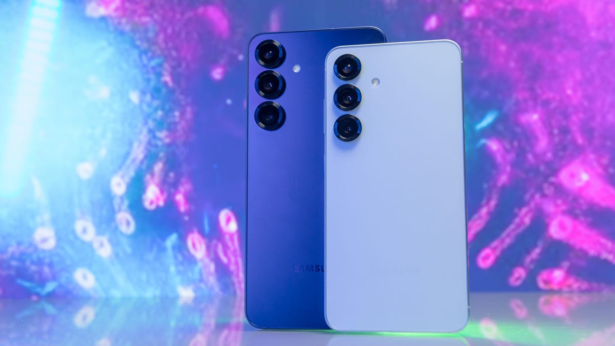 A conceptual render of a sleek metallic smartphone with curvier corners and a vertical triple-camera array on a desk.