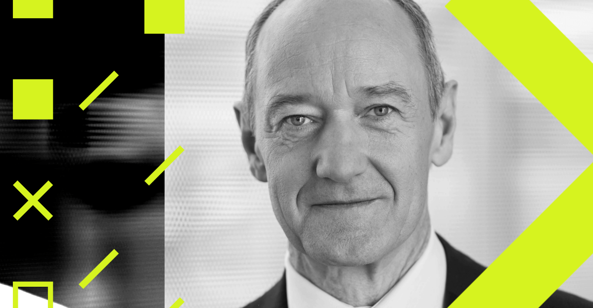 A high-tech automated factory floor featuring robotic arms and glowing blue Siemens logos