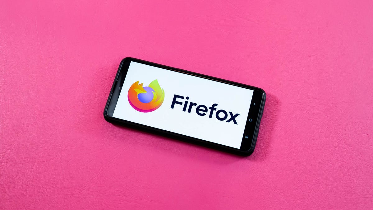 A close-up of a desktop screen showing the Firefox browser settings menu with a toggle switch being clicked to disable AI features.