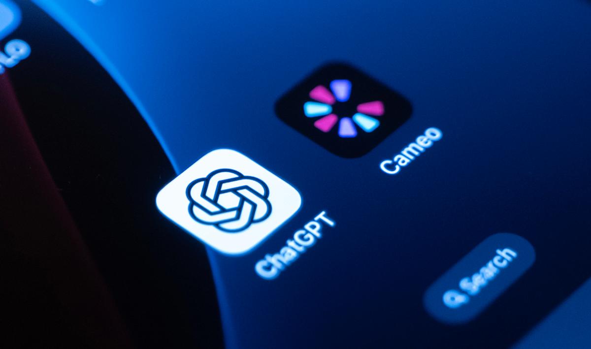 A close-up of a courtroom gavel resting on a digital tablet displaying the OpenAI Sora logo and the word Cameo